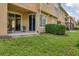 This cozy patio has two chairs and is accessible through glass sliding doors at 8228 Villa Grande Ct, Sarasota, FL 34243
