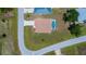 Aerial view of a neighborhood single Gathering home with a screened-in pool at 9325 Crugar Ter, Englewood, FL 34224