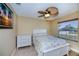 Bedroom with ceiling fan and tile floors at 9325 Crugar Ter, Englewood, FL 34224