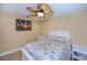 Bedroom with ceiling fan and tile floors at 9325 Crugar Ter, Englewood, FL 34224