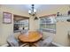 Intimate dining area with natural light and seating for four at 9325 Crugar Ter, Englewood, FL 34224