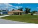 Well-kept home featuring a lush green lawn and an attached two-car garage at 9325 Crugar Ter, Englewood, FL 34224