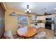 Breakfast nook situated next to modern kitchen with stainless steel appliances at 9325 Crugar Ter, Englewood, FL 34224