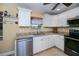 Beautiful updated kitchen with granite counters, modern appliances and bright white cabinetry at 9325 Crugar Ter, Englewood, FL 34224