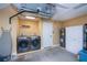 Bright laundry room with modern washer and dryer, water heater, and ample storage cabinets at 9325 Crugar Ter, Englewood, FL 34224