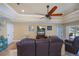 Comfortable living room featuring a flat-screen TV and access to the backyard at 9325 Crugar Ter, Englewood, FL 34224