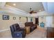 Bright and inviting living room with tray ceilings and neutral color palette at 9325 Crugar Ter, Englewood, FL 34224