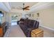 Open living area with comfortable seating overlooking pool and backyard at 9325 Crugar Ter, Englewood, FL 34224