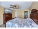 Bedroom with tile floors, ceiling fan, closet and ensuite bathroom at 9325 Crugar Ter, Englewood, FL 34224