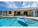 Relaxing screened-in pool area offers a sunny spot for outdoor lounging and dining, with easy access to the home at 9325 Crugar Ter, Englewood, FL 34224