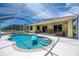 Relaxing screened-in pool area offers a sunny spot for outdoor lounging and dining, with easy access to the home at 9325 Crugar Ter, Englewood, FL 34224