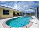 Charming screened-in pool area offers a tranquil oasis for swimming, relaxing, and enjoying outdoor living at 9325 Crugar Ter, Englewood, FL 34224