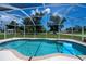 This screened pool offers pristine waters and a sun-soaked lounge area for relaxation and enjoyment at 9325 Crugar Ter, Englewood, FL 34224