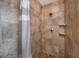 Beautiful tile shower with dual shower heads, tile floor, and glass shower doors at 9325 Crugar Ter, Englewood, FL 34224