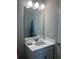 Bright bathroom featuring a single sink, white cabinets, and well-lit mirror at 10258 Morning Mist Ln, Sarasota, FL 34241