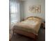 Cozy bedroom with natural light and calm décor at 10258 Morning Mist Ln, Sarasota, FL 34241