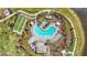 An overhead view showcases a community pool, bocce ball court, spa, and outdoor seating at 10258 Morning Mist Ln, Sarasota, FL 34241