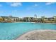 Resort-style community pool area with lush landscaping, cabanas, and ample seating for relaxation at 10258 Morning Mist Ln, Sarasota, FL 34241