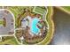 Overhead shot captures the community pool, tennis courts, lush landscaping, and ample parking at 10258 Morning Mist Ln, Sarasota, FL 34241
