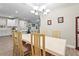 Bright dining room showcasing a stylish chandelier and a dining table with six chairs at 10258 Morning Mist Ln, Sarasota, FL 34241