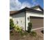 Well-maintained exterior view of home, featuring a two-car garage and neat landscaping at 10258 Morning Mist Ln, Sarasota, FL 34241