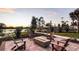 Inviting outdoor fire pit area with comfortable seating, ideal for evening gatherings by the water at 10258 Morning Mist Ln, Sarasota, FL 34241