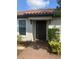 Inviting front door entrance featuring a brick pathway and beautiful landscaping at 10258 Morning Mist Ln, Sarasota, FL 34241
