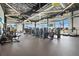 Well-equipped gym featuring modern fitness machines and large windows with bright, natural light and neighborhood views at 10258 Morning Mist Ln, Sarasota, FL 34241