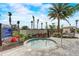 Relaxing hot tub surrounded by lush landscaping and palm trees, perfect for community enjoyment at 10258 Morning Mist Ln, Sarasota, FL 34241