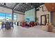 Stylish lounge featuring comfortable seating arrangements, large windows, and modern decor at 10258 Morning Mist Ln, Sarasota, FL 34241