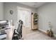 Home office space with desk, chair, and view to a bathroom with light tile flooring at 10258 Morning Mist Ln, Sarasota, FL 34241