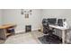 Office space featuring an ergonomic chair, light colored walls and neutral-colored area rug at 10258 Morning Mist Ln, Sarasota, FL 34241