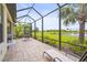 Spacious screened patio offering tranquil water views and comfortable lounging at 10258 Morning Mist Ln, Sarasota, FL 34241