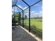Screened patio overlooking a beautiful green landscape at 10258 Morning Mist Ln, Sarasota, FL 34241
