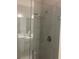 Modern shower with glass door and rainfall shower head against gray tile at 10258 Morning Mist Ln, Sarasota, FL 34241