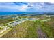 Aerial view of the community showing proximity to the ocean at 10487 Coquina Ct, Placida, FL 33946