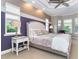 This bedroom offers a tray ceiling and windows which flood the space with lots of natural light at 10487 Coquina Ct, Placida, FL 33946