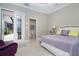 A bedroom featuring access to the lanai and ensuite bathroom at 10487 Coquina Ct, Placida, FL 33946