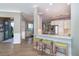 Modern kitchen with stainless steel appliances and breakfast bar seating at 10487 Coquina Ct, Placida, FL 33946