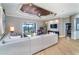 Bright living room featuring hardwood floors, decorative ceiling, and comfortable seating at 10487 Coquina Ct, Placida, FL 33946