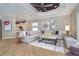 Comfortable living room with hardwood floors and a view into the kitchen at 10487 Coquina Ct, Placida, FL 33946