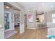 Open-concept living space with hardwood floors and an open view to the kitchen at 10487 Coquina Ct, Placida, FL 33946