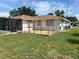 The back yard features a fenced-in pet area and well-maintained lawn space at 11029 Vanessa Ave, Englewood, FL 34224