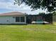 Back yard featuring pool area and shed on a sunny day. Plenty of space for activities at 11029 Vanessa Ave, Englewood, FL 34224