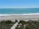 Ocean and sandy beach featuring clear waters and a serene coastline view at 11029 Vanessa Ave, Englewood, FL 34224