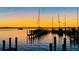 Sunset on water with several boats docked and beautiful sunset at 11029 Vanessa Ave, Englewood, FL 34224