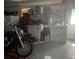 Garage with workbench area, offering ample space for projects and storage needs at 11029 Vanessa Ave, Englewood, FL 34224