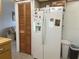 Clean kitchen area with refrigerator and pantry at 11029 Vanessa Ave, Englewood, FL 34224