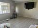 Bright living room with tile flooring at 11029 Vanessa Ave, Englewood, FL 34224