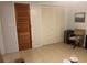 Spacious room with tile floors, multiple closets, and a warm, inviting atmosphere at 11029 Vanessa Ave, Englewood, FL 34224